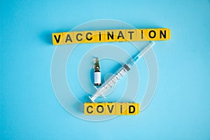 Various medicines on blue background for Vaccination against  Corona Virus. Concept of fight against coronavirus, vaccination,