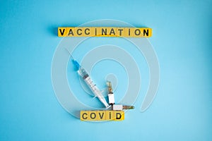 Various medicines on blue background for Vaccination against  Corona Virus. Concept of fight against coronavirus, vaccination,