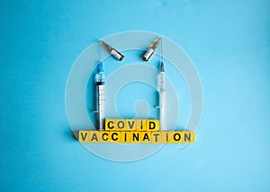 Various medicines on blue background for Vaccination against  Corona Virus. Concept of fight against coronavirus, vaccination,