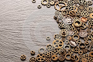 Various metal cogwheels with USA coins