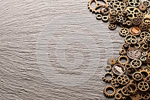 Various metal cogwheels with USA coins