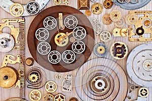 Various metal parts on wooden background