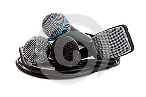 Various microphones on a white backgrounf