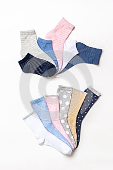 Various modern trendy women`s cotton socks set on white background. Fashionable socks store. Socks shopping, sale, merchandise,