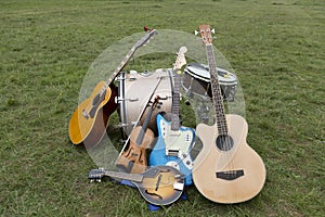 Various musical instruments piled up on the ground