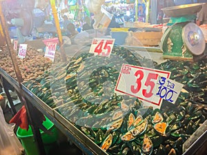 Various Mussels freshly caught for sale at the seafood market, Thailand