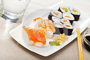 Various of nigiri and hosomaki sushi traditionally served with wasabi and soy sauce