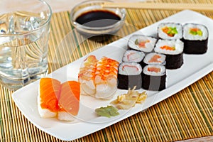 Various of nigiri and hosomaki sushi traditionally served with wasabi and soy sauce