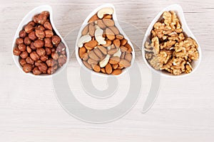 Various nuts and almonds as source healthy natural vitamins and minerals, place for inscription