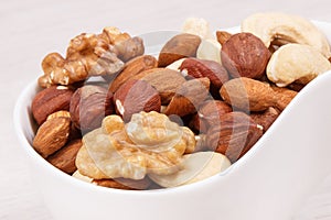 Various nuts and almonds as source natural vitamins, nutritious eating concept