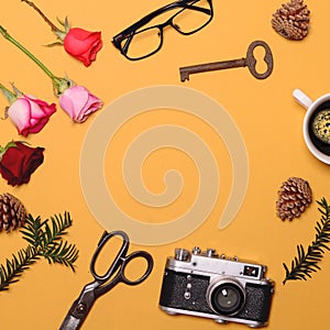 Various objcects on yellow background with space in middle - Trendy minimal flat lay concept