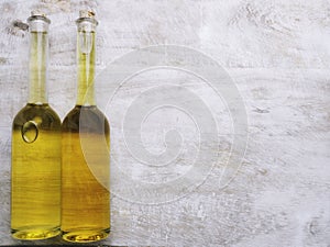 Various oil glass bottles on wooden background