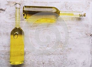 Various oil glass bottles on wooden background