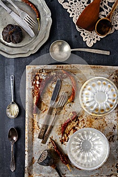 Various old kitchen objects on black chalkboard background