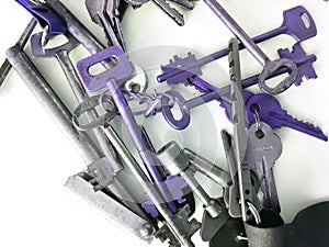 Various old lock picks, keys on a white background