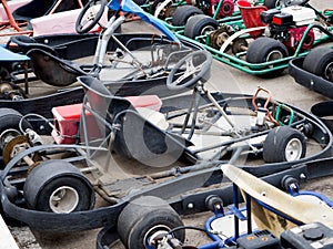 Various old semi-dismantled race cars without a body