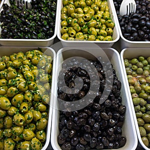 Various olives for sale at a market