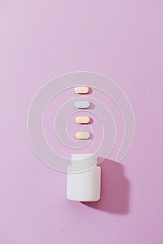 Various pharmaceuticals. All on pink background.