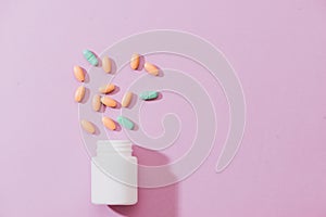 Various pharmaceuticals. All on pink background.