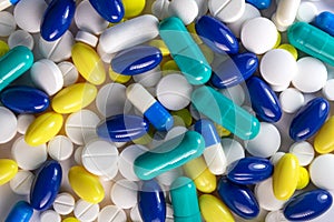 Various pills, aspirins and medication capsules. photo