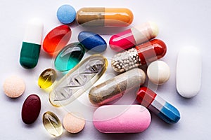 Various pills and one DND pill close-up. Macro shot on a white table