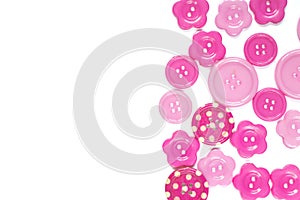 Various pink sewing buttons isolated on white background