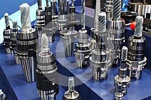 Various polygonal, hydraulic and heat shrinking toolholders with various, mostly drill tools attached