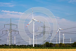 Various power lines and wind turbines