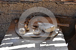 Various primitive objects found in an old hut made of wicker, clay and mud