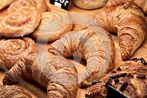 Various Puff pastry, Croissants and Rolls on the Shelf of Bakery store