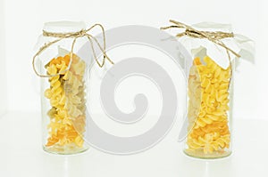 The various raw pasta in a glass jar