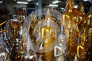 Various religious golden figurines in a souvenir shop