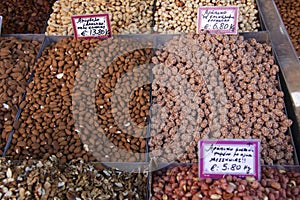 Roasted nuts on a market stall photo
