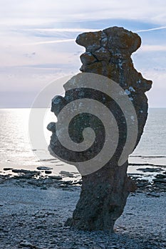 Hand-shaped rock formation on the island of FÃÂ¥rÃÂ¶, sunset, Langhammars RaukomrÃÂ¥de, Sweden, Gotland, Europe photo