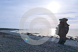 Hand-shaped rock formation on the island of FÃÂ¥rÃÂ¶, sunset, Langhammars RaukomrÃÂ¥de, Sweden, Gotland, Europe photo