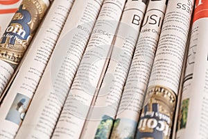 Various rolled newspapers, closeup