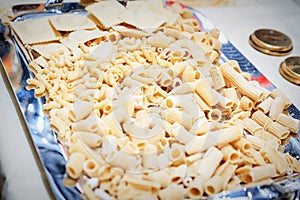 Raw pasta background close up
