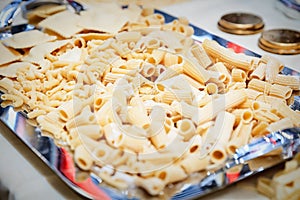 Raw pasta background close up