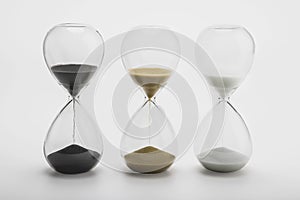 Various sand clock , Various hourglass as time passing on white background , Life time concept