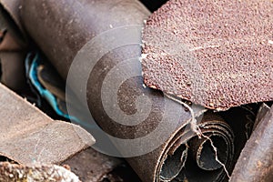 Various sandpaper grit in a bulk closeup