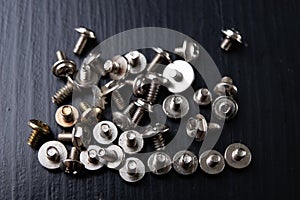 Various screws for assembling computer sets. Accessories for mechanic electronics