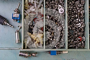 Various screws for assembling computer sets. Accessories for mechanic electronics