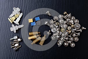 Various screws for assembling computer sets. Accessories for mechanic electronics