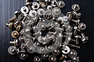 Various screws for assembling computer sets. Accessories for mechanic electronics