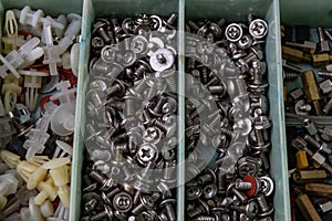 Various screws for assembling computer sets. Accessories for mechanic electronics