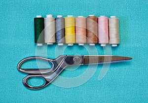 Various Sewing Accessories: colored threads, scissors