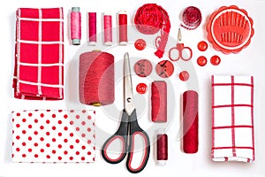 Various sewing accessories and tools red shades