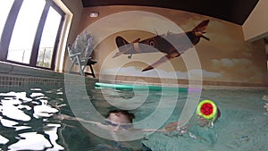 Various shots of a family playing in a private swimming pool