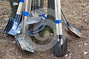 Various shovels linked together prepared to transport