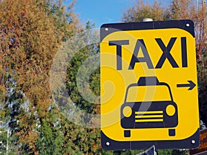 Various signs on the street in yellow and black